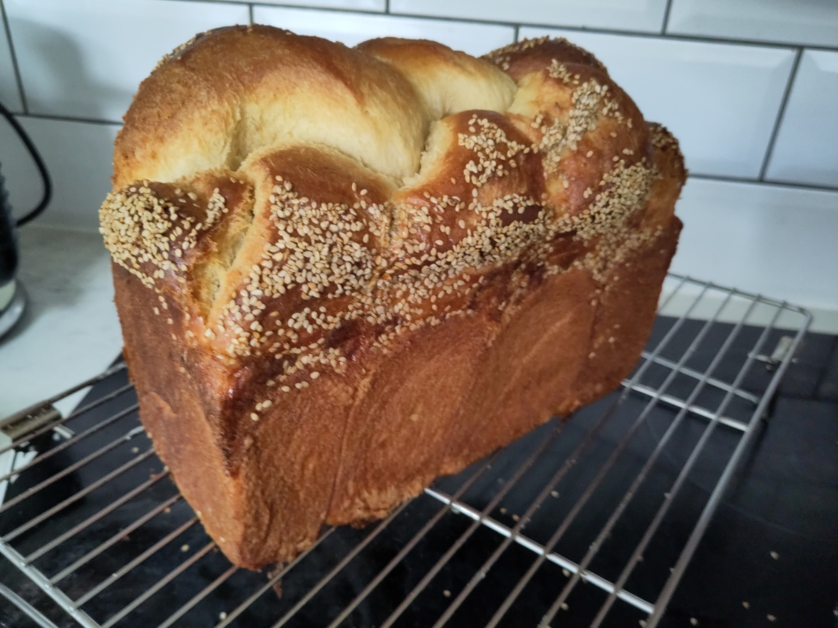 braided brioche loaf with sesame seeds
