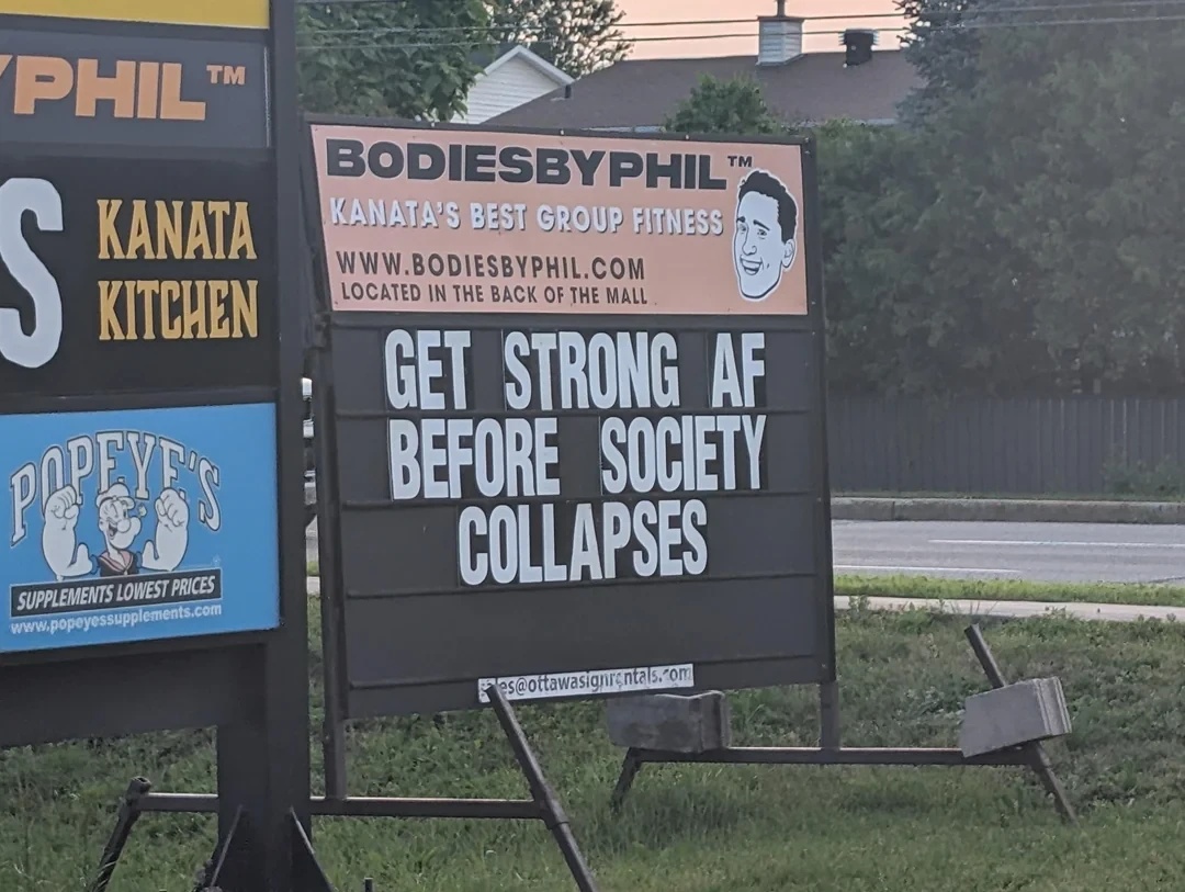 Gym sign ad reads: "Get strong AF before society collapses"