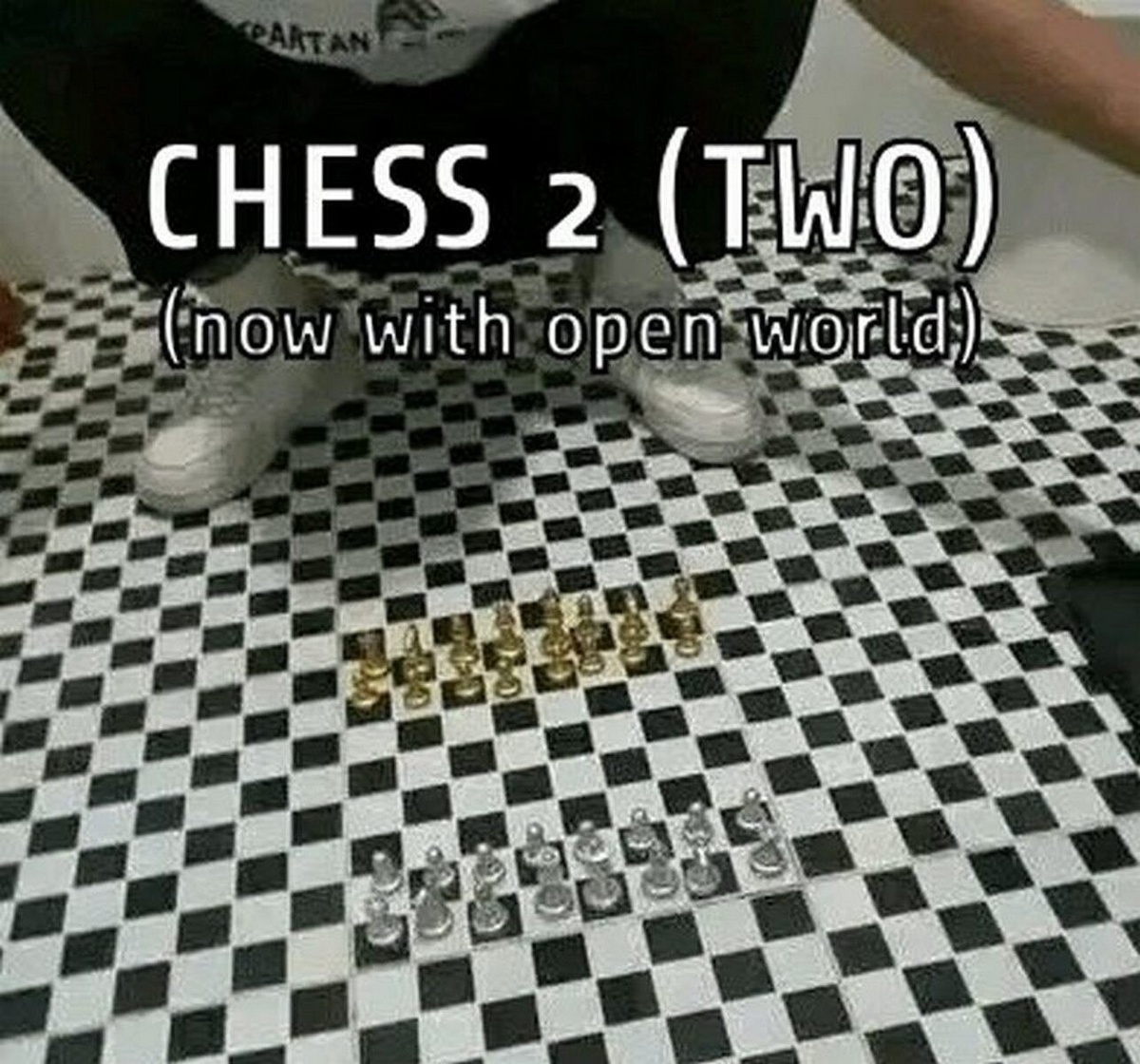 Chess pieces on initial position but they are actually not on a board, but on large chequered floor