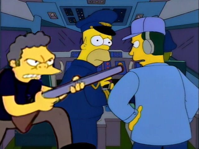Moe Szyslak brandishing a double-barreled shotgun in a cockpit, ostensibly defending Homer (who is dressed as a pilot), as a flight controller insists Homer fly the plane, his protests being met by "You flyboys crack me up"