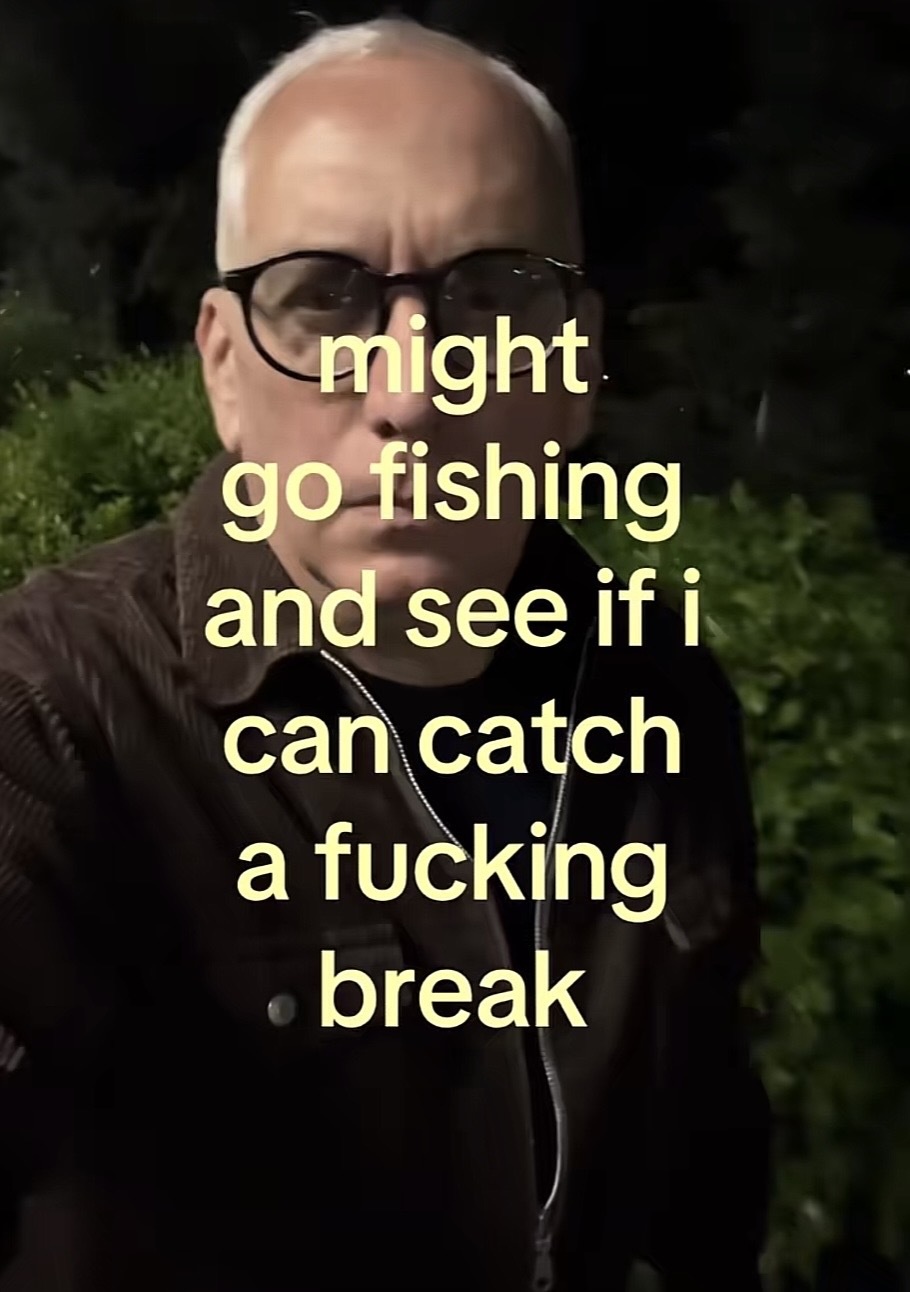 Selfie of a person outside at night with the caption (yellow text) “might go fishing and see if i can catch a fucking break”