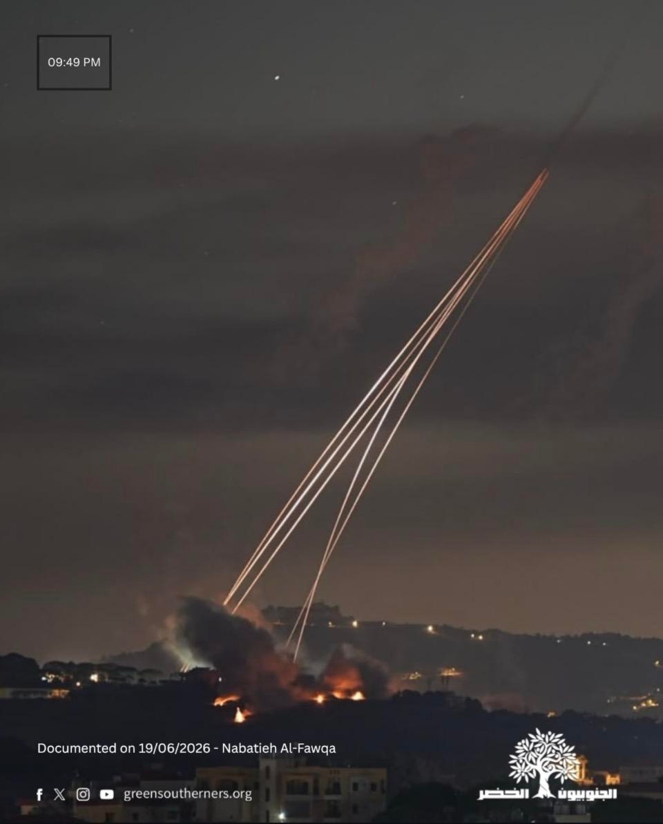 a photo of a bombardment with several bright light trails in the late evening sky, “Documented on 19/06/2026 - Nabatieh Al-Fawqa”